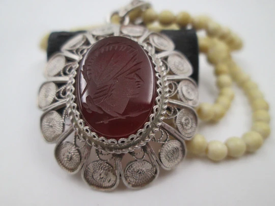 Women's ivory necklace with 900 sterling silver filigree pendant. Warrior cameo. 1940's