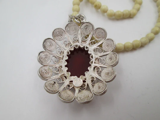 Women's ivory necklace with 900 sterling silver filigree pendant. Warrior cameo. 1940's