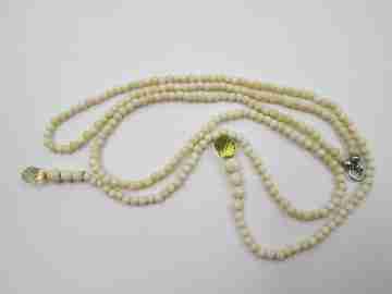 Women's necklace. Ivory beads & citrine ends. White gold rings. 1950's