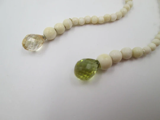 Women's necklace. Ivory beads & citrine ends. White gold rings. 1950's