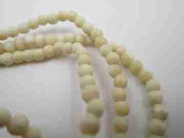 Women's necklace. Ivory beads & citrine ends. White gold rings. 1950's