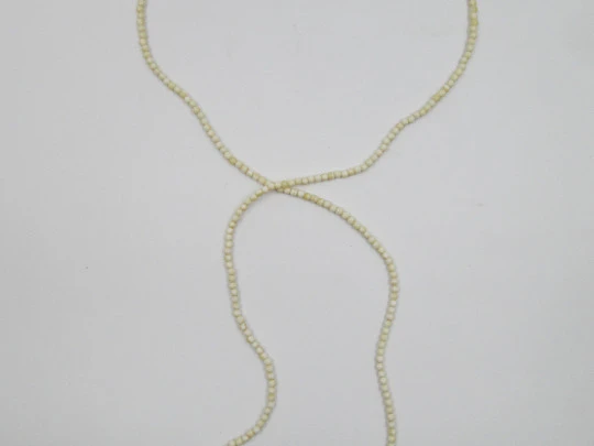 Women's necklace. Ivory beads & citrine ends. White gold rings. 1950's