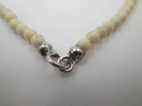 Women's necklace. Ivory beads & citrine ends. White gold rings. 1950's