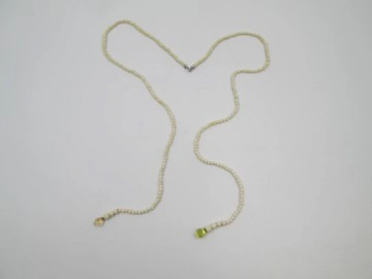 Women's necklace. Ivory beads & citrine ends. White gold rings. 1950's