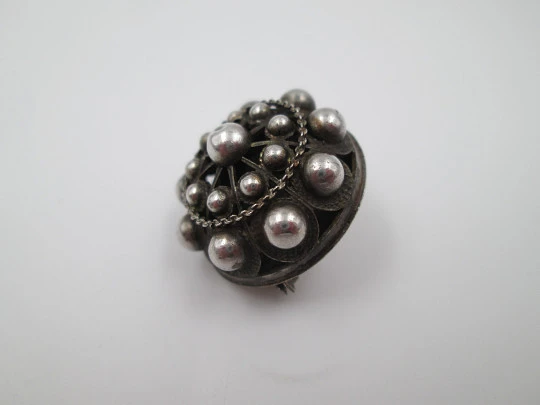 Women's openwork brooch. Charro button shape. 925 sterling silver. 1990's. Spain