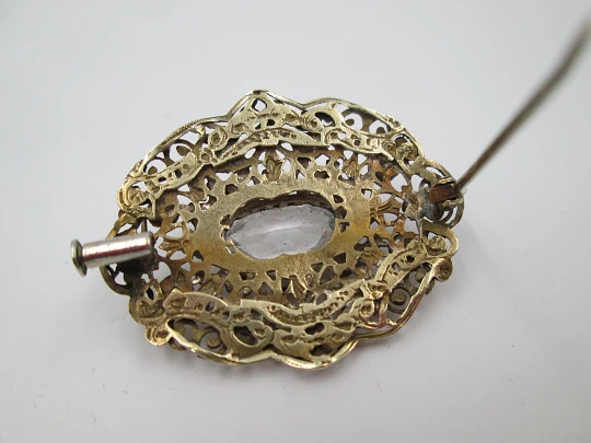 Women's openwork brooch. Gold plated metal and white rhinestones. Europe. 1950's