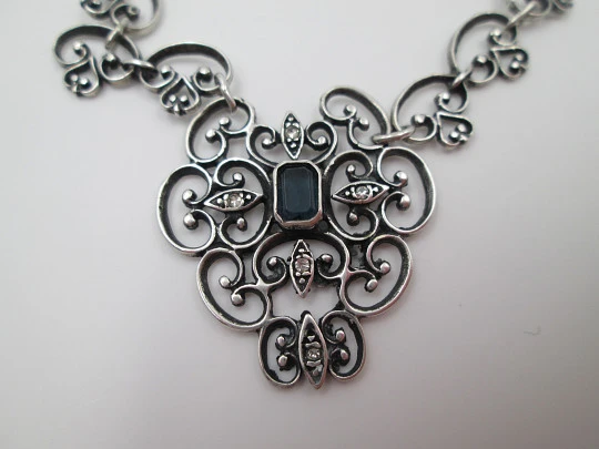 Women's openwork necklace. Sterling silver. Blue stone & white gems pendant