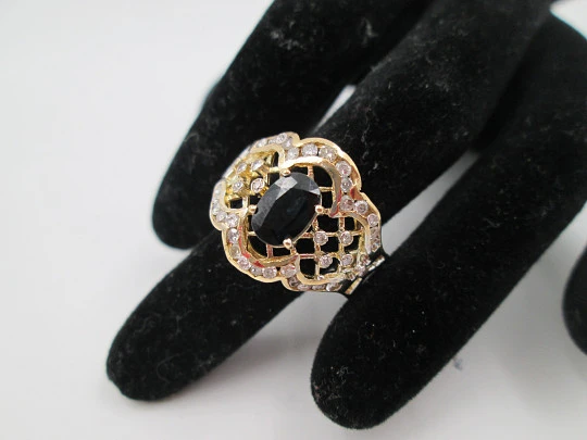 Women's openwork ring. 18 karat yellow gold, diamonds and sapphire. Europe