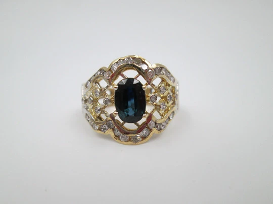 Women's openwork ring. 18 karat yellow gold, diamonds and sapphire. Europe