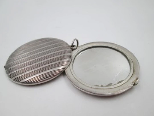 Women's pendant mirror. Sterling silver. Lines motifs. Tab clasp. 1970's