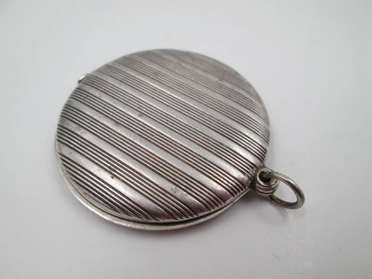 Women's pendant mirror. Sterling silver. Lines motifs. Tab clasp. 1970's