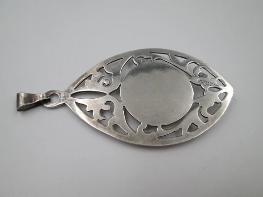 Women's pendant. Aztec calendar. Sterling silver. Ring on top. Mexico. 1980's