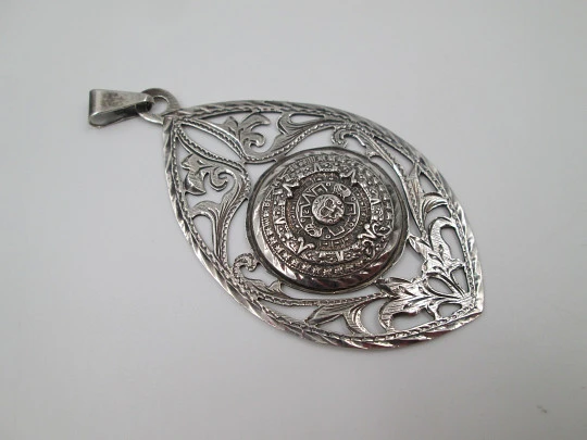 Women's pendant. Aztec calendar. Sterling silver. Ring on top. Mexico. 1980's