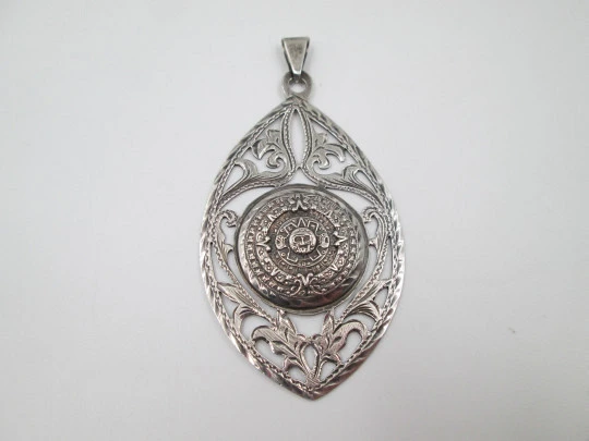 Women's pendant. Aztec calendar. Sterling silver. Ring on top. Mexico. 1980's