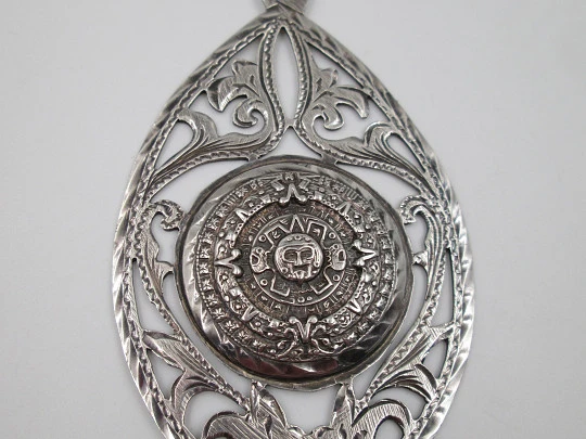 Women's pendant. Aztec calendar. Sterling silver. Ring on top. Mexico. 1980's