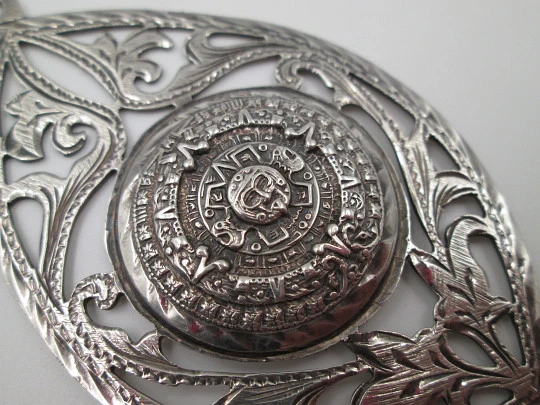 Women's pendant. Aztec calendar. Sterling silver. Ring on top. Mexico. 1980's