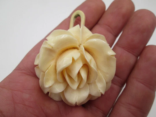 Women's pendant. Pretty ivory rose with open petals. Ring on top. Europe. 1950's