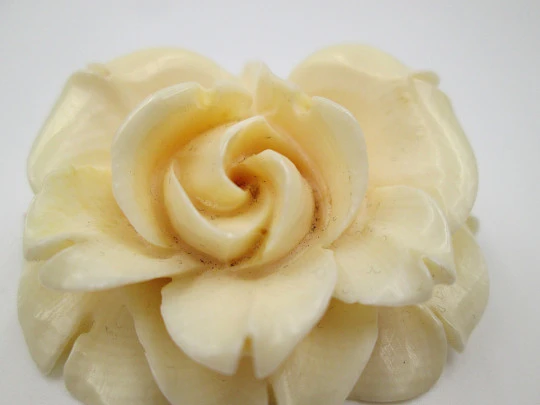 Women's pendant. Pretty ivory rose with open petals. Ring on top. Europe. 1950's