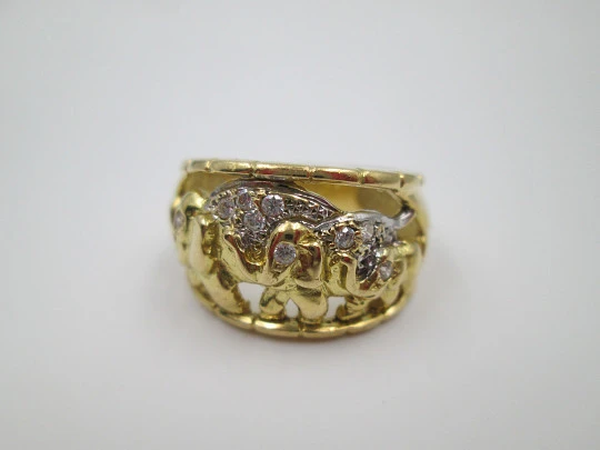 Women's ring. 18 karat gold & white sapphires. Elephants herd. 1990's