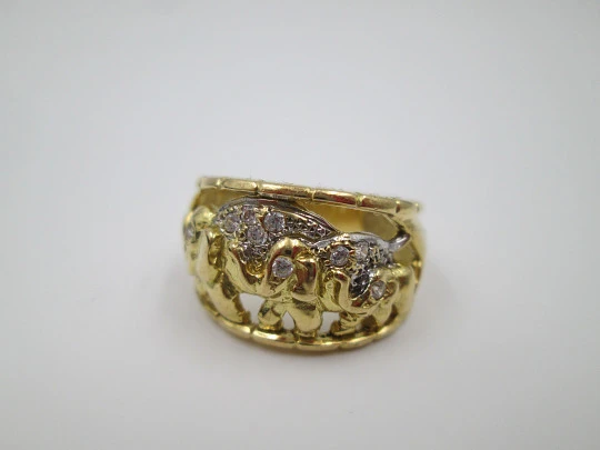 Women's ring. 18 karat gold & white sapphires. Elephants herd. 1990's