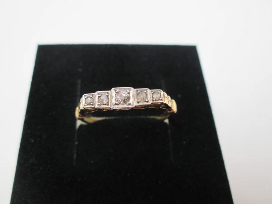 Women's ring. 18 karat yellow gold and five diamonds. Circa 1950's