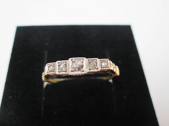 Women's ring. 18 karat yellow gold and five diamonds. Circa 1950's