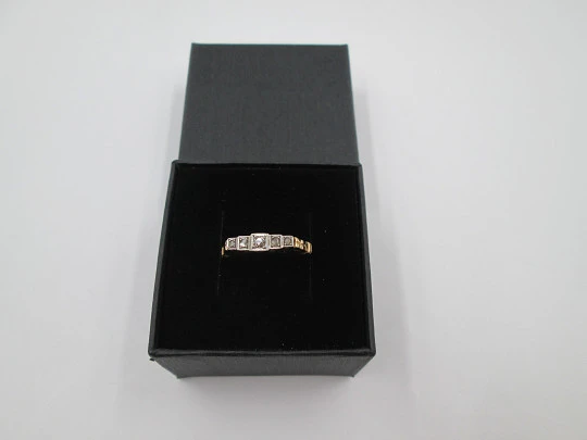 Women's ring. 18 karat yellow gold and five diamonds. Circa 1950's