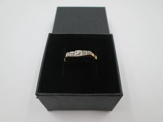 Women's ring. 18 karat yellow gold and five diamonds. Circa 1950's