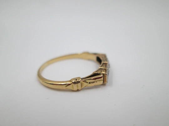 Women's ring. 18 karat yellow gold and five diamonds. Circa 1950's