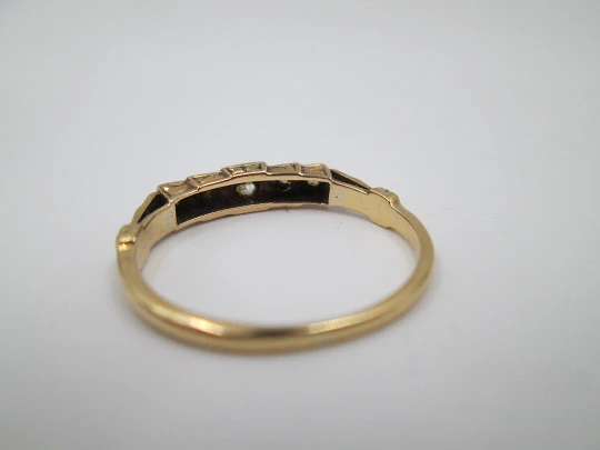 Women's ring. 18 karat yellow gold and five diamonds. Circa 1950's