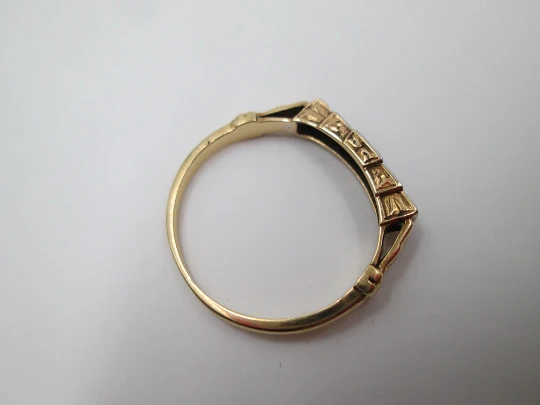 Women's ring. 18 karat yellow gold and five diamonds. Circa 1950's