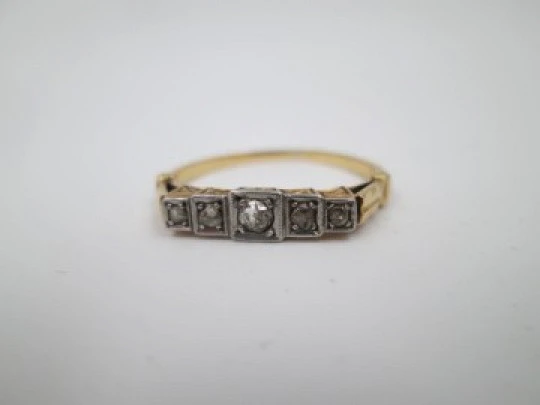 Women's ring. 18 karat yellow gold and five diamonds. Circa 1950's