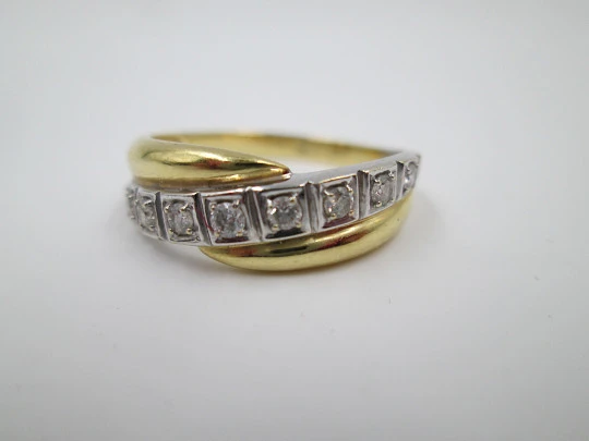 Women's ring. 18 karat yellow & white gold. Nine diamonds. Circa 2005