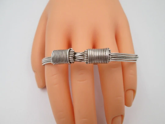 Women's seven-strand sterling silver knotted bracelet with adjustable clasp. 1990's. Spain