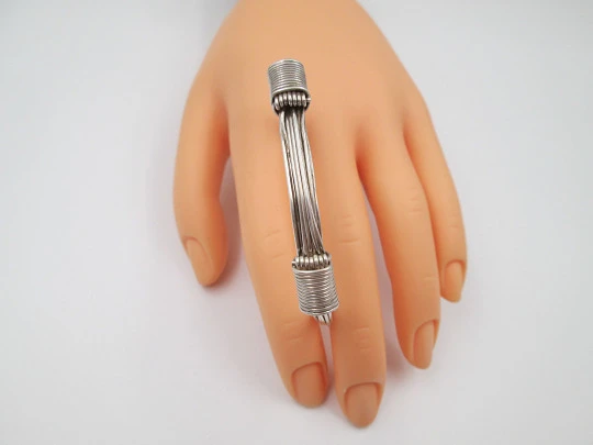 Women's seven-strand sterling silver knotted bracelet with adjustable clasp. 1990's. Spain
