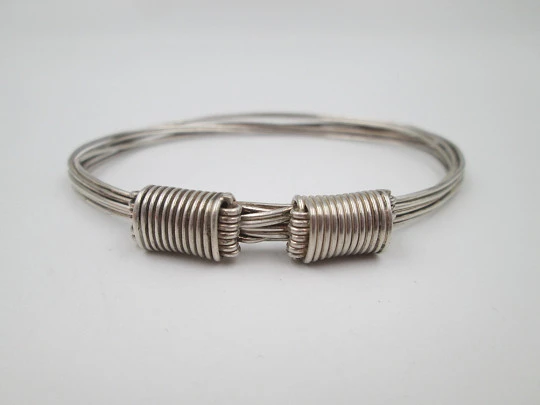 Women's seven-strand sterling silver knotted bracelet with adjustable clasp. 1990's. Spain