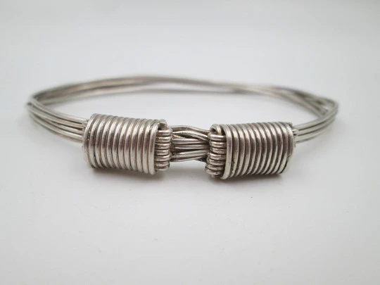 Women's seven-strand sterling silver knotted bracelet with adjustable clasp. 1990's. Spain