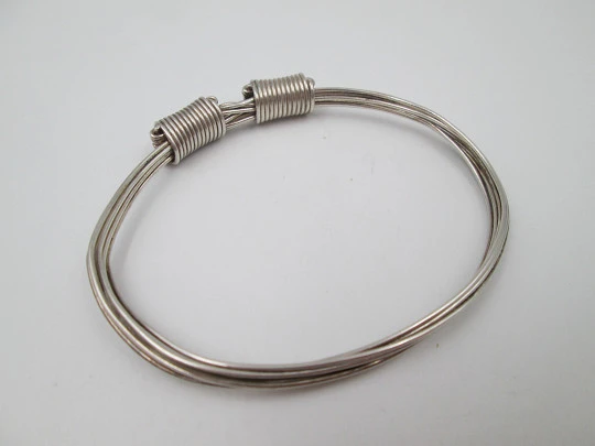 Women's seven-strand sterling silver knotted bracelet with adjustable clasp. 1990's. Spain