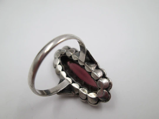 Women's shuttle ring. Silver and gold edge. Garnet stone & marcasite gems