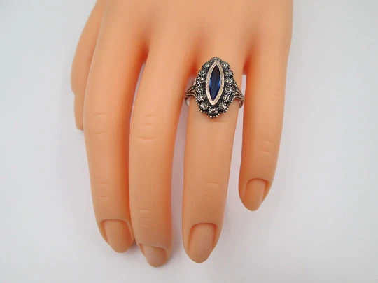 Women's shuttle ring. Sterling silver, marcasite stones and blue gem. Gold trims. Portugal