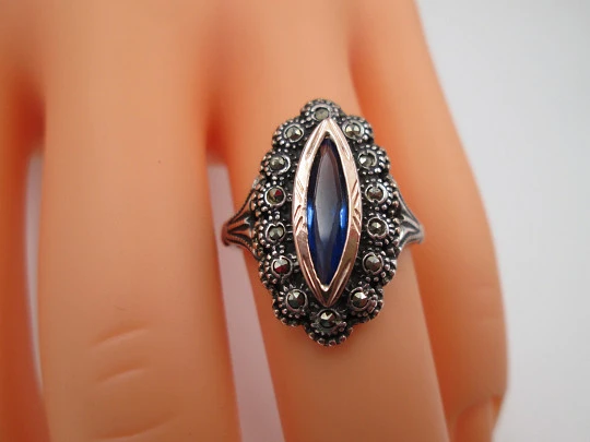 Women's shuttle ring. Sterling silver, marcasite stones and blue gem. Gold trims. Portugal