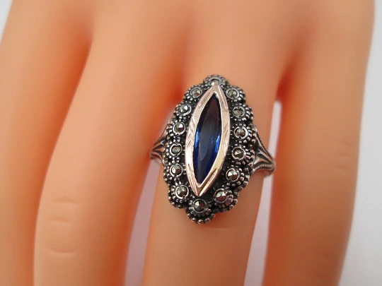 Women's shuttle ring. Sterling silver, marcasite stones and blue gem. Gold trims. Portugal