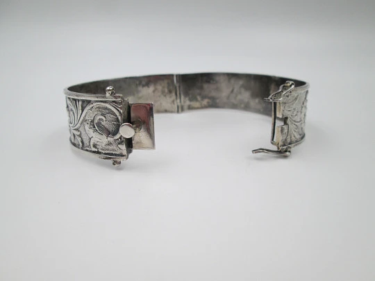 Women's sterling silver bangle bracelet. Floral and vegetable motifs. Tab security clasp. 1980 Women's sterling silver bangle bracelet. Floral and vegetable motifs. Tab security clasp. 1980