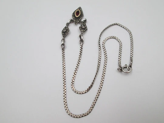 Women's sterling silver necklace and ring set. Marcasite stones, gold and garnet gems Women's sterling silver necklace and ring set. Marcasite stones, gold and garnet gems