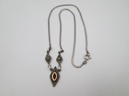 Women's sterling silver necklace and ring set. Marcasite stones, gold and garnet gems Women's sterling silver necklace and ring set. Marcasite stones, gold and garnet gems
