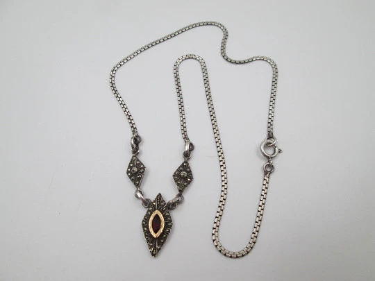 Women's sterling silver necklace and ring set. Marcasite stones, gold and garnet gems Women's sterling silver necklace and ring set. Marcasite stones, gold and garnet gems