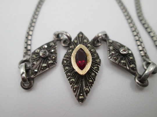 Women's sterling silver necklace and ring set. Marcasite stones, gold and garnet gems Women's sterling silver necklace and ring set. Marcasite stones, gold and garnet gems
