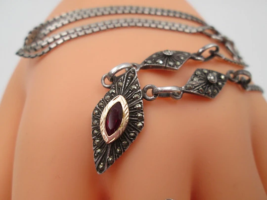 Women's sterling silver necklace and ring set. Marcasite stones, gold and garnet gems Women's sterling silver necklace and ring set. Marcasite stones, gold and garnet gems