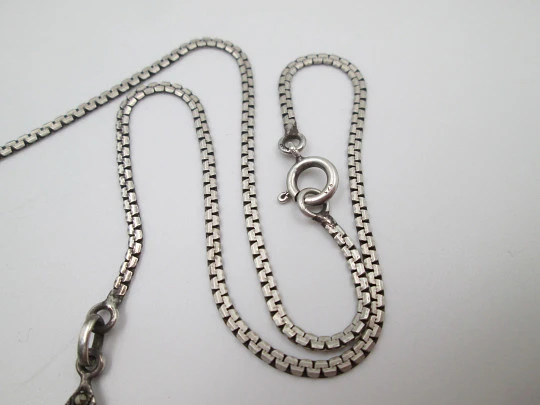 Women's sterling silver necklace and ring set. Marcasite stones, gold and garnet gems Women's sterling silver necklace and ring set. Marcasite stones, gold and garnet gems