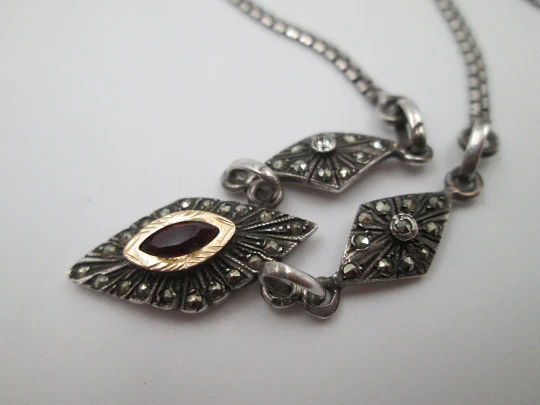 Women's sterling silver necklace and ring set. Marcasite stones, gold and garnet gems Women's sterling silver necklace and ring set. Marcasite stones, gold and garnet gems